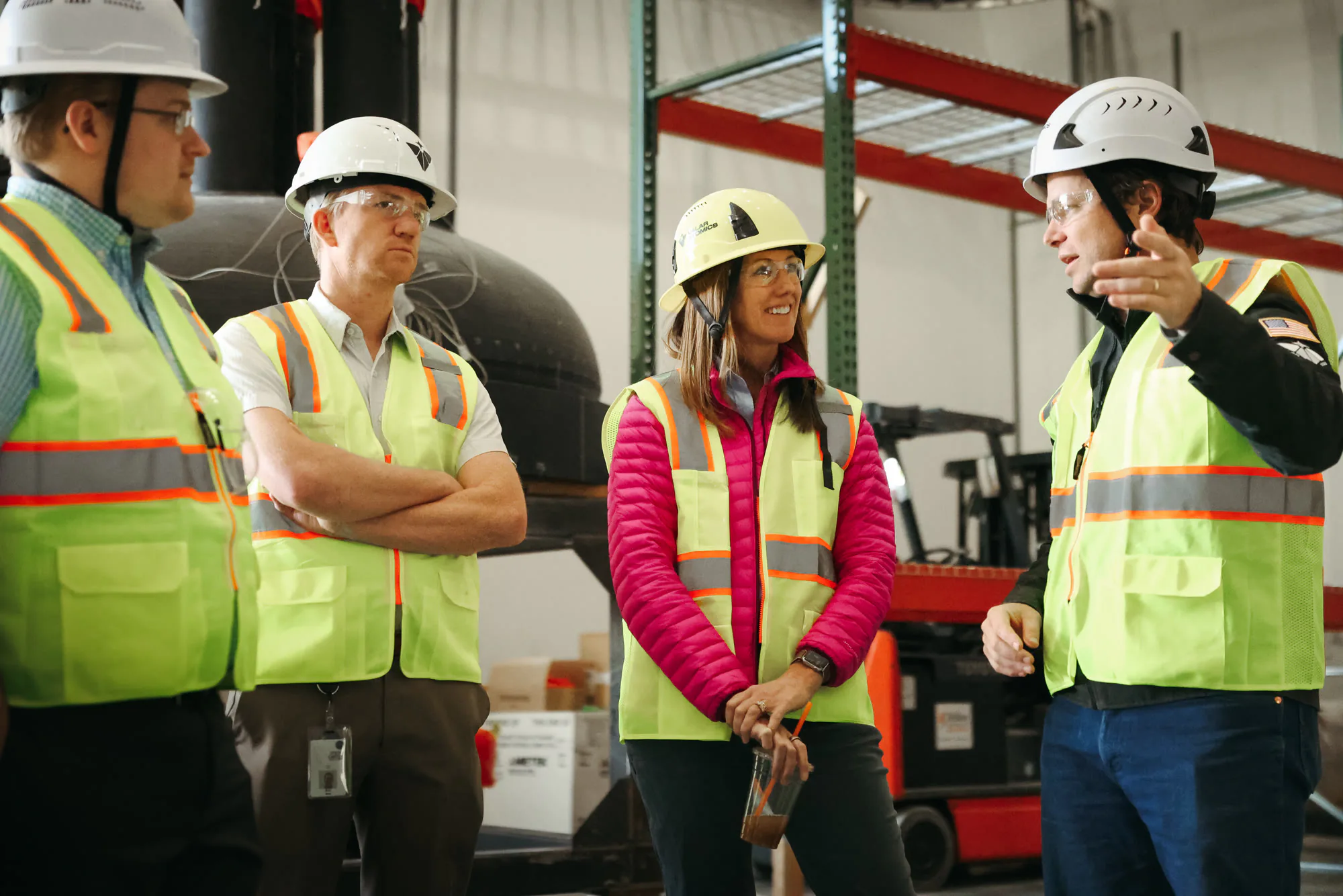 Visitors touring the facility in hard hats